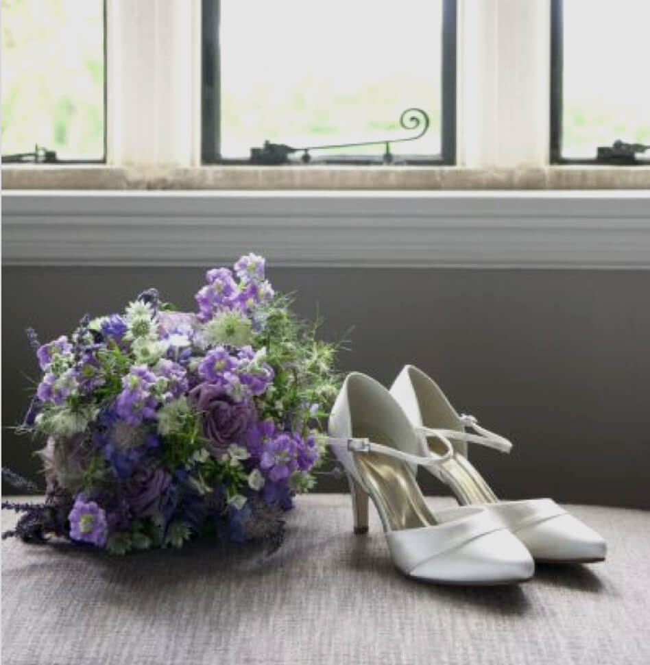 Photo of white bridal shoes